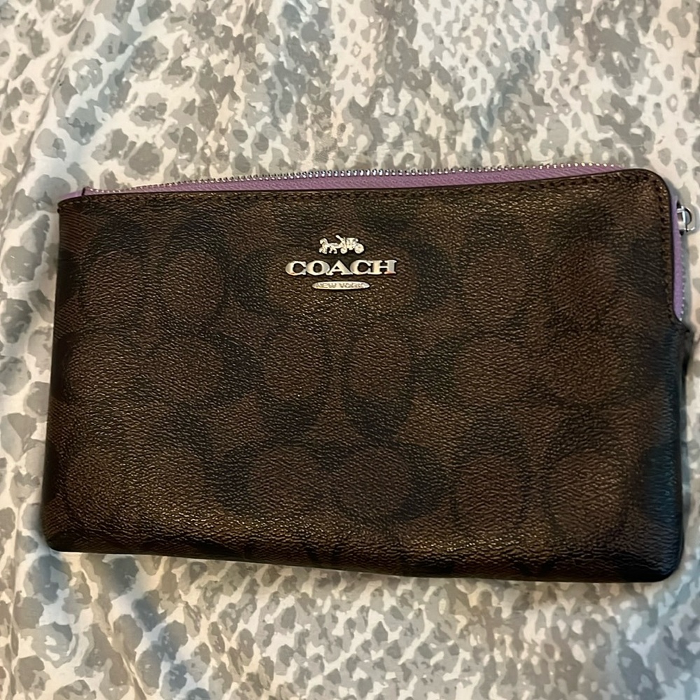 Coach wristlet wallet lightly used dark brown with purple zipper.